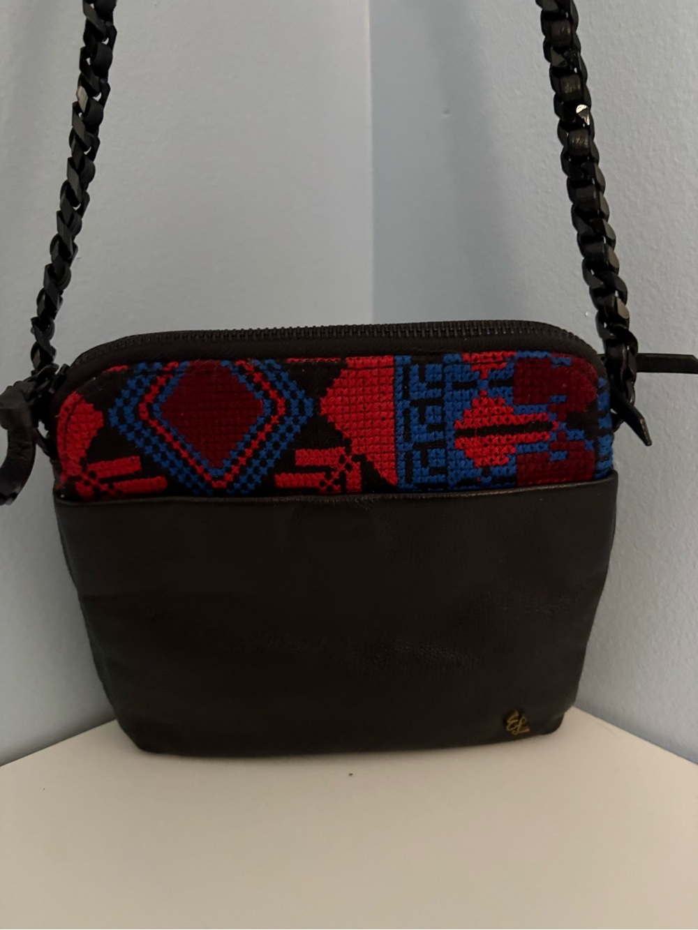 Elliot Luca Black Leather Crossbody Bag with Red & Blue Woven Detail